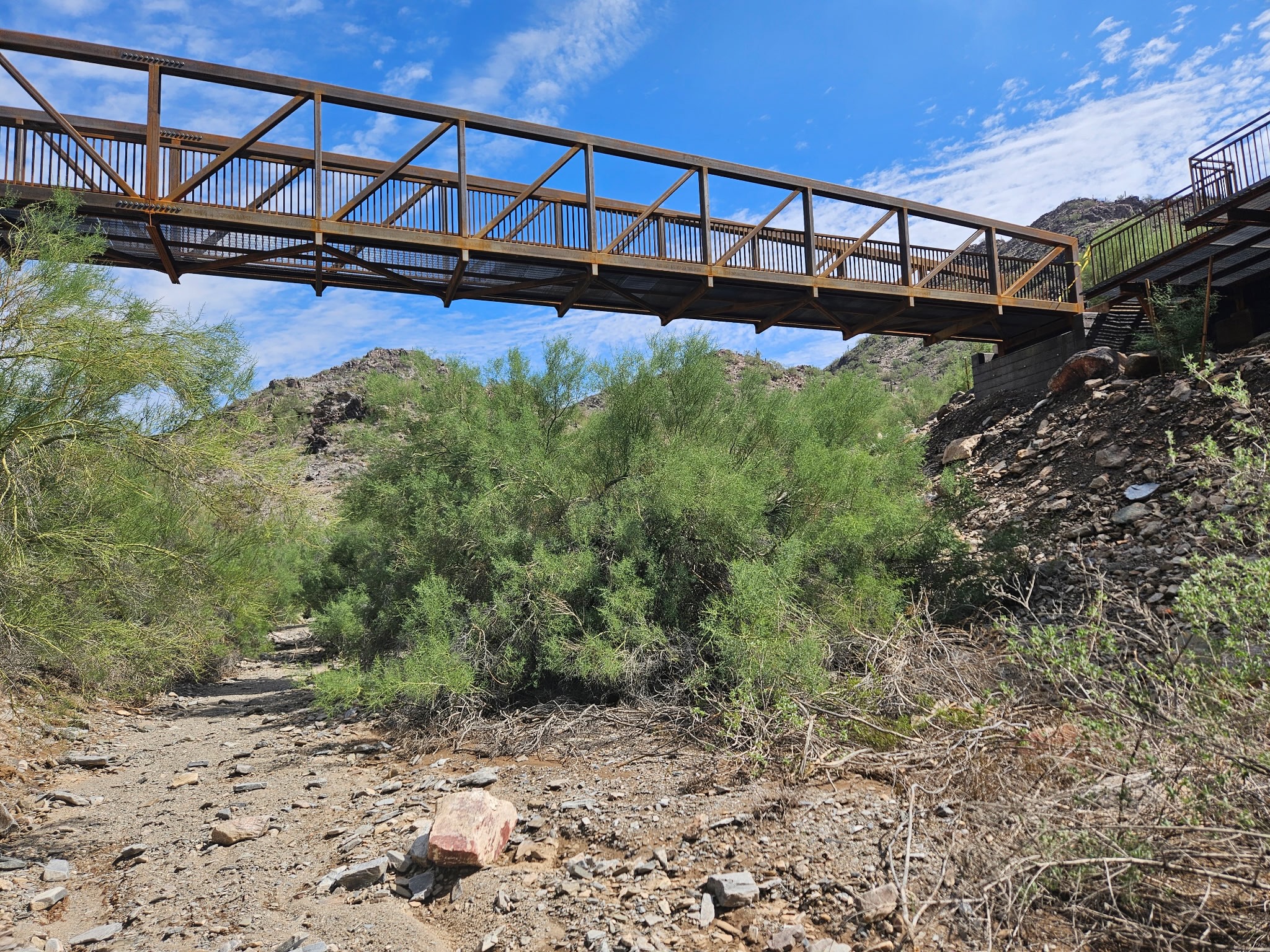Completed steel-and-concrete footbridge at Ocotillo Trailhead